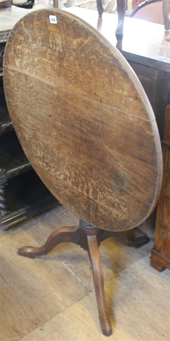 Circular oak snap top table